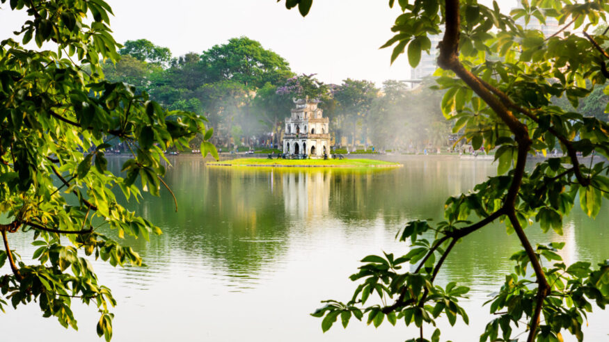 Turtle Tower in Hanoi Hoan Kiem foggy lake in Vietnam