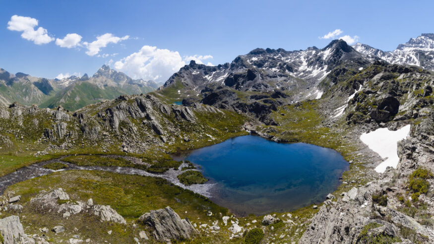 The Lac Bleu in Chianale, mountain lake in the italian alps of Cuneo in Piedmont, italy, facing the famous Monviso peak (mount viso)