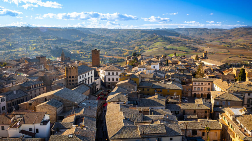 View of old town of Orvieto in Italy from above rooftops at sunset