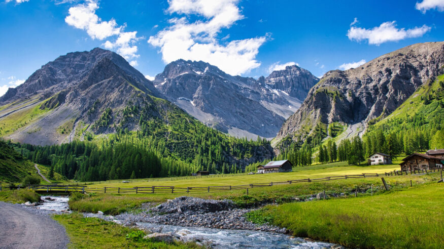 swiss mountain valley with mountain river and alps in the background, Davos, Sertig, Switzerland
