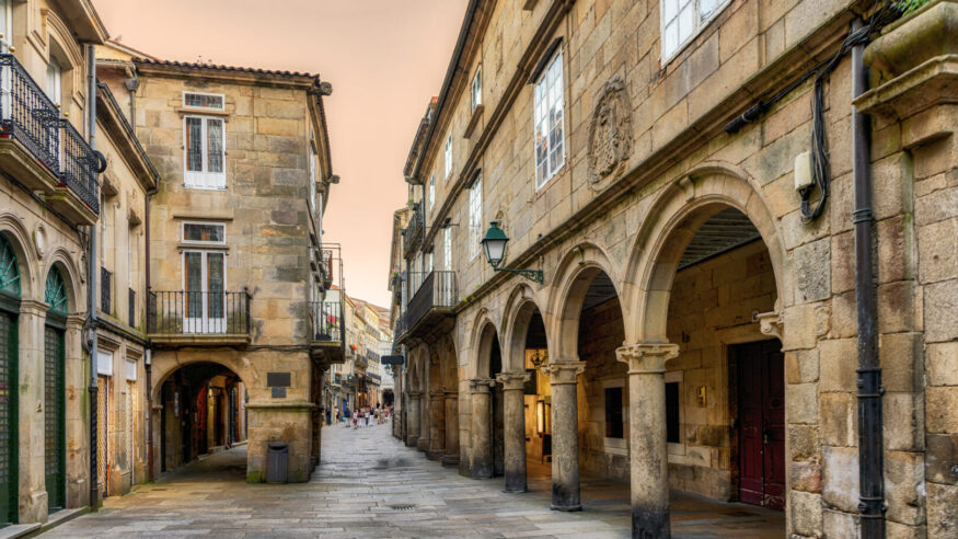 View of pedestrian street and building facades in old town Santiago de Compostela, Spain.