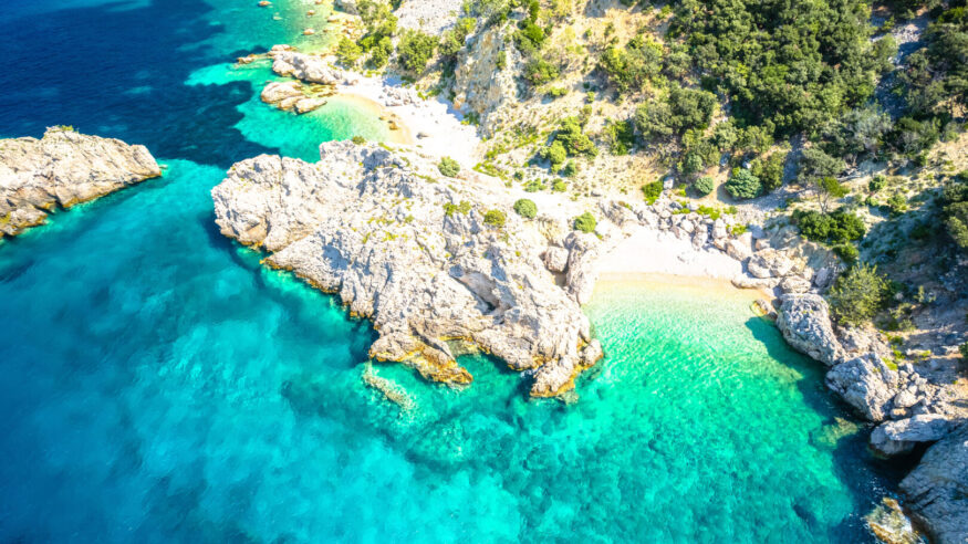 Idyllic hidden beach near Lubenice aerial view, Cres island of Croatia